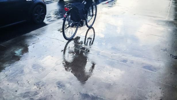 Wet Street with bycicle reflection