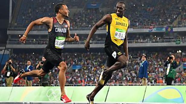 Usain Bolt und Andre De Grasse laufen um die Wette.