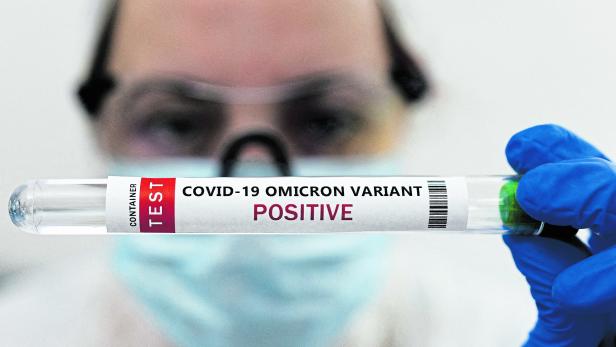 FILE PHOTO: Illustration shows test tube labelled "COVID-19 Omicron variant test positive\