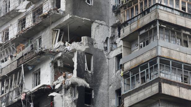 FILE PHOTO: A view shows a damaged residential building in the besieged city of Mariupol