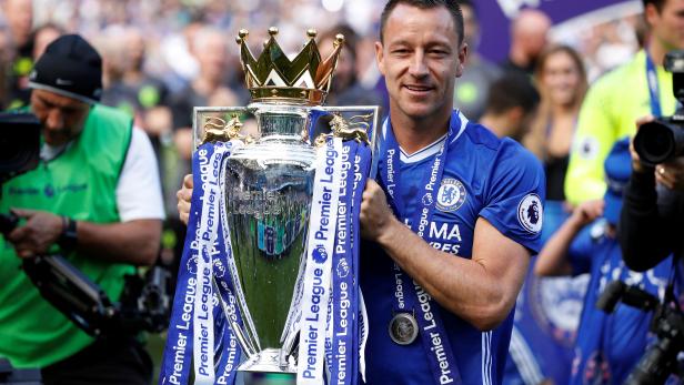 FILE PHOTO: Chelsea's John Terry celebrates with the trophy after winning the Premier League