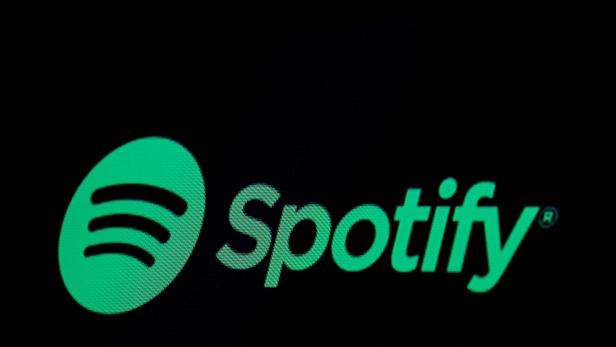 FILE PHOTO: The Spotify logo is displayed on a screen on the floor of the NYSE in New York