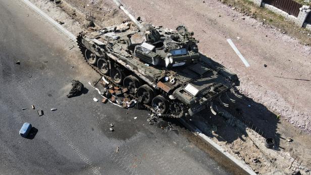 A charred Russian tank is seen, amid Russia's invasion of Ukraine, on the front line in the Kyiv region