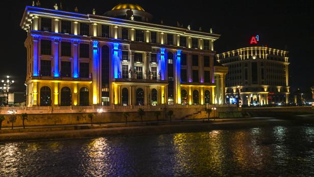 A building of North Macedonia's Ministry of Foreign Affairs  illuminated with the colors of the Ukrainian flag