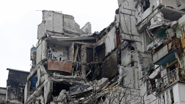 A view shows a heavily damaged apartment building in the besieged city of Mariupol