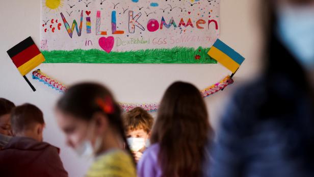 Refugee children who fled following Russia's invasion of Ukraine, attend a school preparation course in Dusseldorf