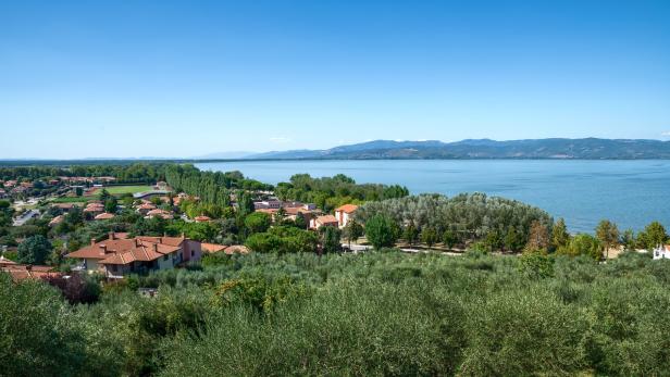 Castiglione del lago, Umbria, Italy. August 2020. Amazing landscape of the Trasimeno lakefront. From the top of the hill of the historic village the view is very wide.