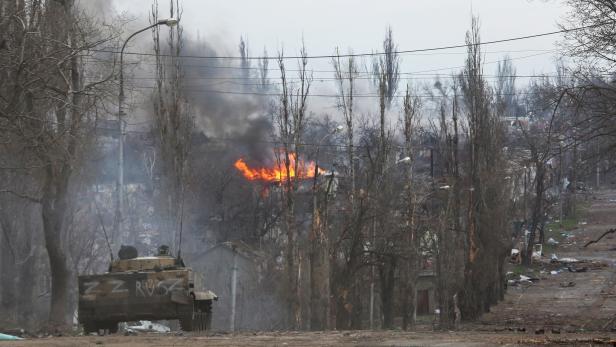 An armoured vehicle of pro-Russian troops is seen in the street in Mariupol