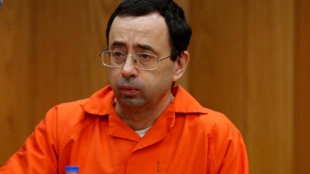 FILE PHOTO: Larry Nassar, a former team USA Gymnastics doctor who pleaded guilty in November 2017 to sexual assault charges, sits in the courtroom during his sentencing hearing in the Eaton County Court in Charlotte