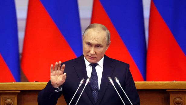 Russian President Vladimir Putin delivers a speech during a meeting of the Council of Legislators at the Federal Assembly in Saint Petersburg