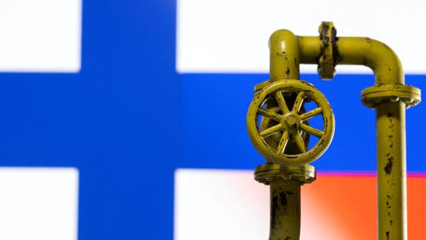 FILE PHOTO: Illustration shows natural gas pipeline, Finnish and Russian flag colours