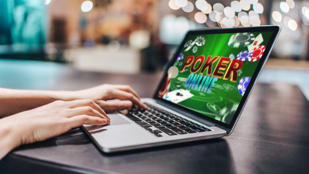Girl using her laptop for playing poker online