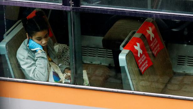 A woman rides a tram amid the coronavirus disease (COVID-19) outbreak in Brussels