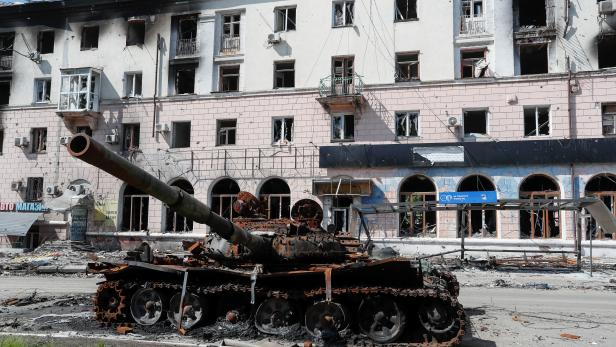 A view shows a burnt tank in Mariupol