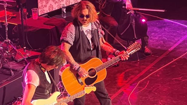 Actor Johnny Depp joins musician Jeff Beck on stage during concert, in Gateshead