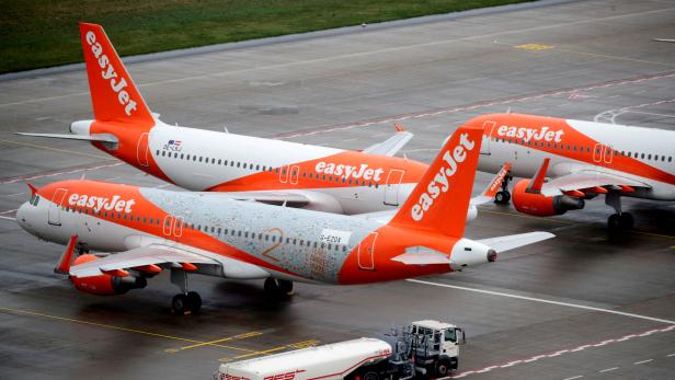 FILE PHOTO: EasyJet airplanes are parked on the tarmac during the official opening of the new Berlin-Brandenburg Airport (BER) "Willy Brandt", in Schoenefeld near Berlin