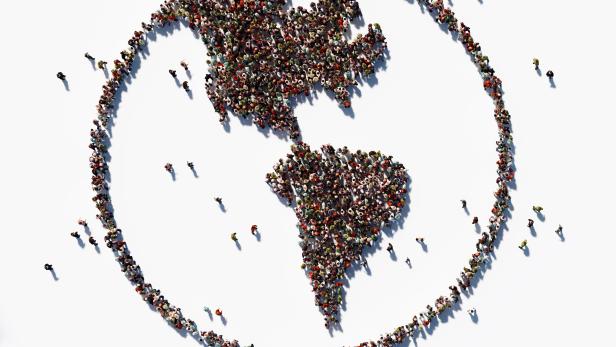 Human Crowd Forming World Symbol: Population And Social Media Concept