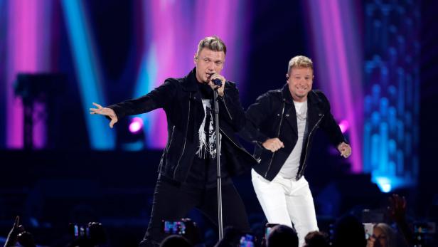Nick Carter (L) and Brian Littrell of the Backstreet Boys perform during the iHeartRadio Music Festival at T-Mobile Arena in Las Vegas