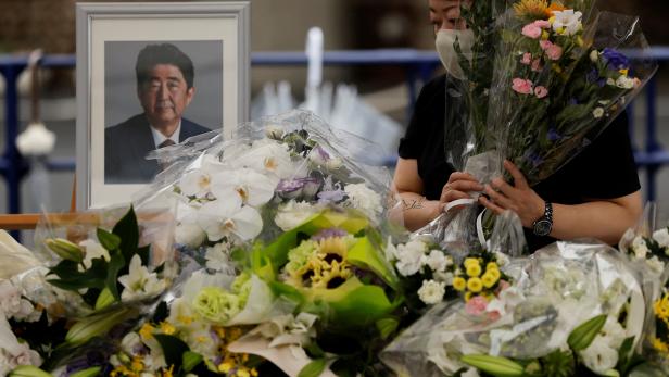 Mourners gather at the altar for the late former Japanese Prime Minister Shinzo Abe, in Tokyo