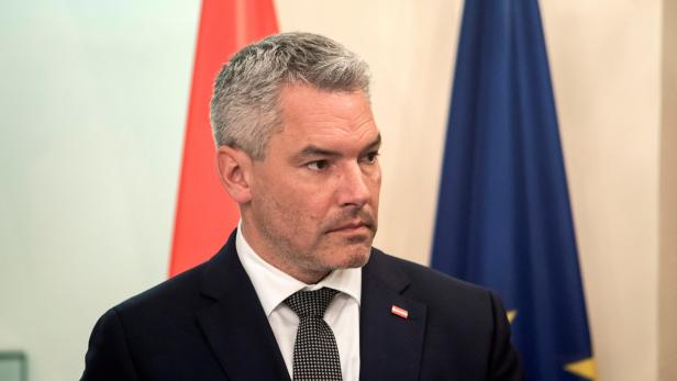 Austrian Chancellor Karl Nehammer attends a news conference at the Presidential Palace in Nicosia