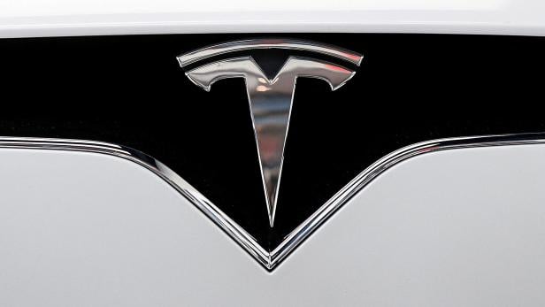 FILE PHOTO: The Tesla logo is seen on a car at Tesla Motors' new showroom in Manhattan's Meatpacking District in New York