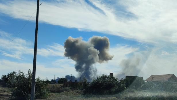 Smoke rises after explosions were heard near Novofedorivka