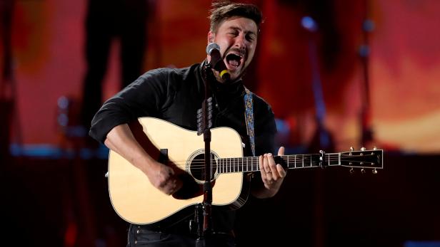 Lead singer Marcus Mumford performs with Mumford & Sons during the iHeartRadio Music Festival at T-Mobile Arena in Las Vegas