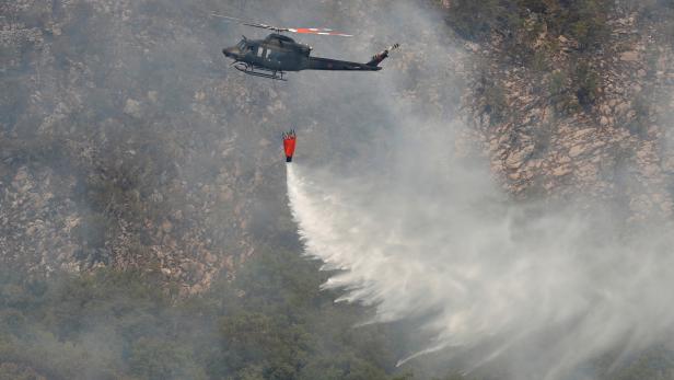 Montenegrin army assist firefighters battle forest fire from the air
