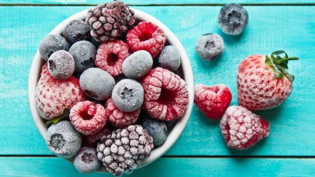 Frozen berries in a bowl. Various mix berry