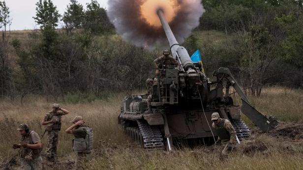 Ukrainian servicemen fire a 2S7 Pion self-propelled gun at a position in Donetsk region
