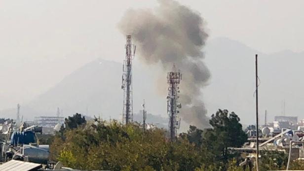 Smoke billows near military hospital after an explosion in Kabul