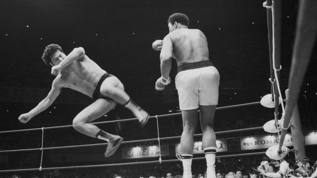 FILE PHOTO: World boxing heavyweight champion Muhammad Ali of the U.S. fights against Japanese pro-wrestler Antonio Inoki during a mixed martial arts match in Tokyo