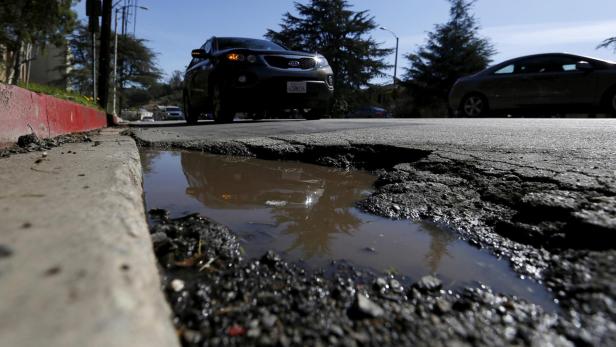 FILE PHOTO: A pothole is pictured on the street of Los Angeles