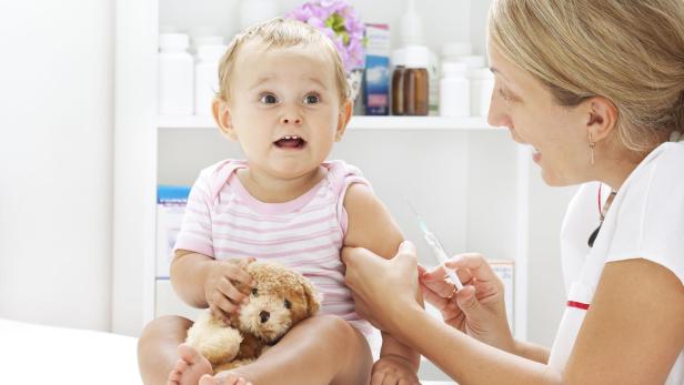 Cute Baby Girl Receiving Vaccine