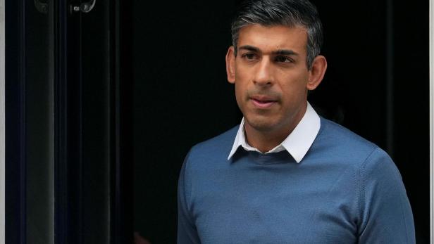 Conservative MP Rishi Sunak leaves his home address in London