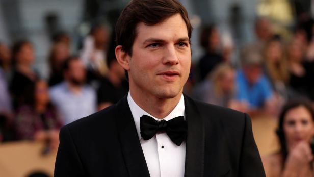 FILE PHOTO: Actor Ashton Kutcher arrives at the 23rd Screen Actors Guild Awards in Los Angeles