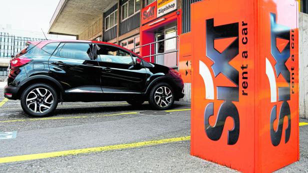 FILE PHOTO: The logo of German car rental company Sixt is seen in front of a branch office in Zurich