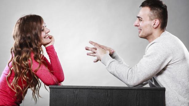 Happy couple talking on date. Conversation.