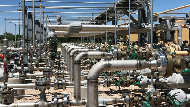 FILE PHOTO: Equipment used to process carbon dioxide, crude oil and water is seen at an Occidental Petroleum Corp enhanced oil recovery project in Hobbs