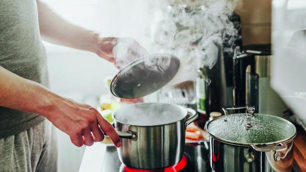 Man cooking fresh food at home