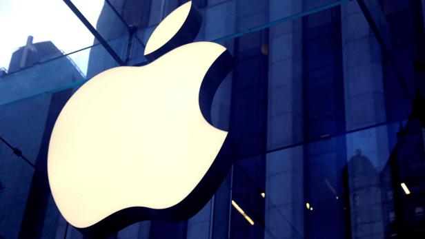 FILE PHOTO: The Apple Inc. logo is seen hanging at the entrance to the Apple store on 5th Avenue in New York, U.S.