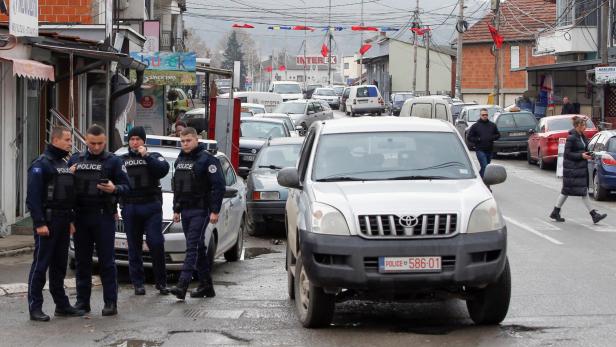 Kosovo police officers patrol in ethnically mixed area in North Mitrovica