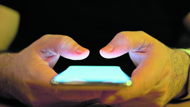 Young Men Using Smart Phone Social Media Concept