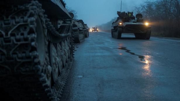 Armoured personnel carriers of the Ukrainian Armed Forces are seen on a road in Kherson region