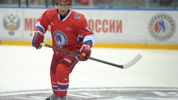 FILE PHOTO: Russian President Putin takes part in an invitational ice hockey match in Sochi
