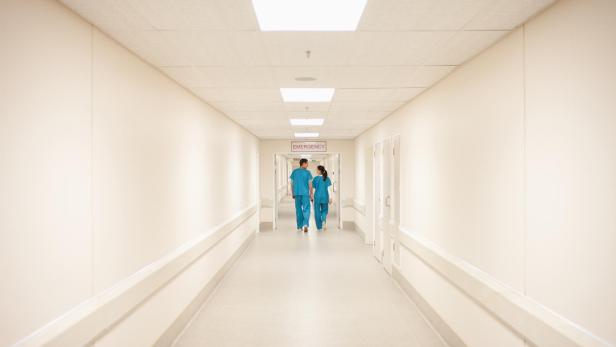 Nurses walking down hospital corridor