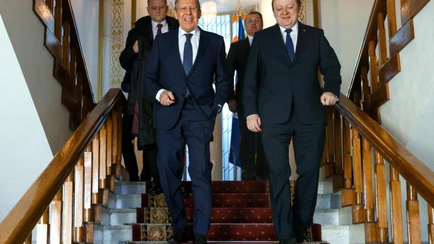 Russian Foreign Minister Sergei Lavrov and Belarusian Foreign Minister Sergei Aleinik walk during a meeting in Minsk