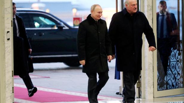 FILE PHOTO: Russian President Vladimir Putin and Belarusian President Alexander Lukashenko arrive for meeting in Minsk