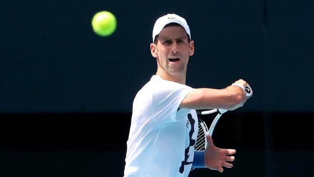 FILE PHOTO: Novak Djokovic practices on court ahead of 2022 Australian Open