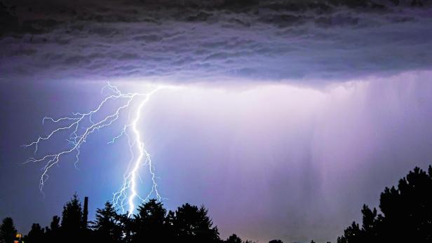 powerful lightning strikes over the night sky